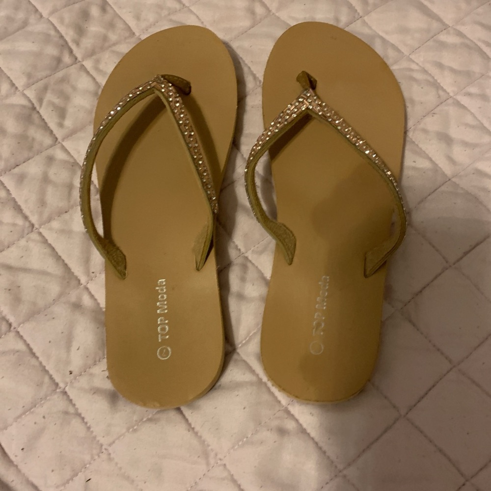 Beige flip flops